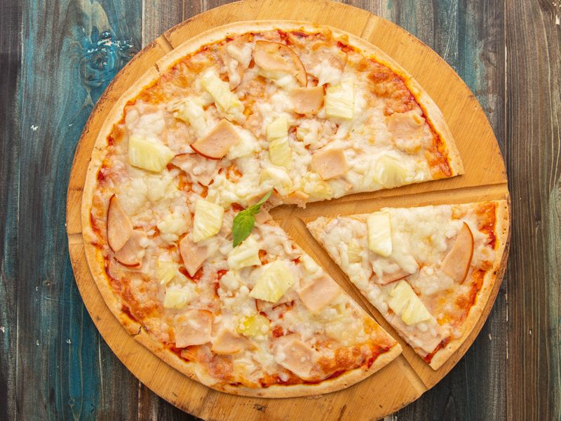 Hawaiian Sunset pizza with ham, pineapple and mozzarella