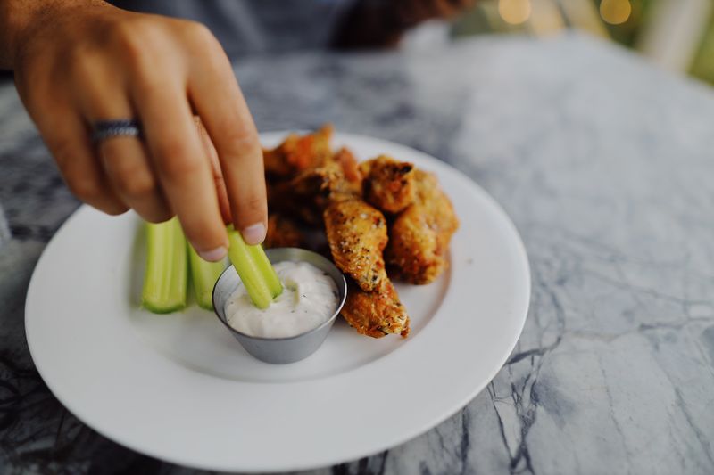 Buffalo Wings with blue cheese dipping sauce